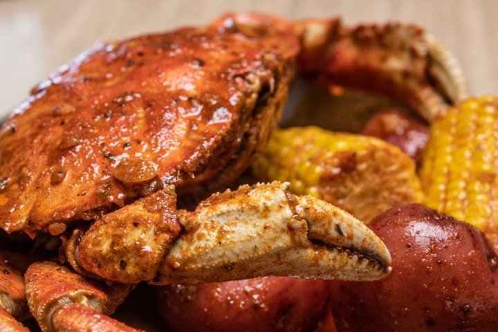 Combo Deal #2: a whole Dungeness crab with corn and potatoes in KC sauce.