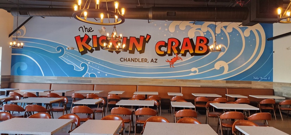 The Chandler dining room with the Kickin&rsquo; Crab mural on the wall.